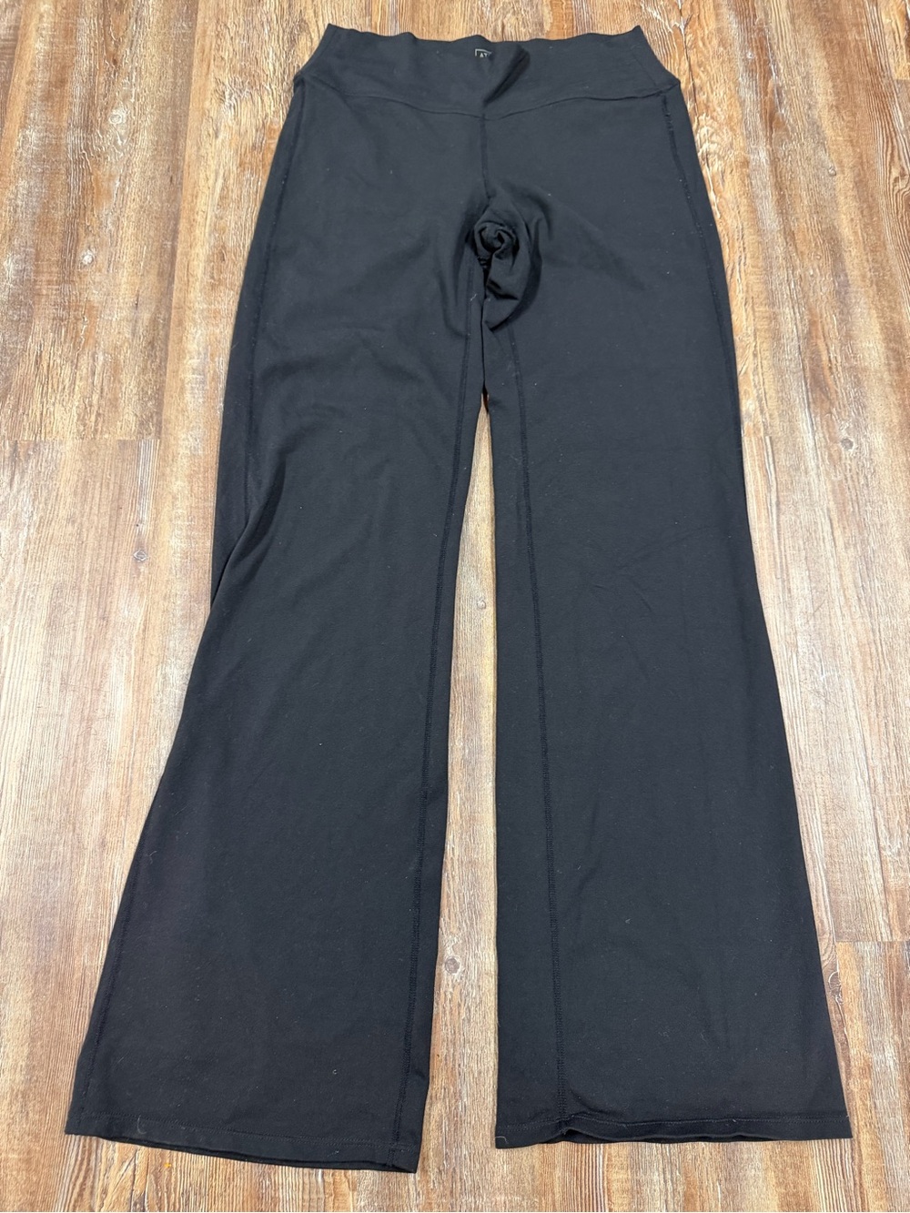 Athleta black flare leggings with pockets in size S